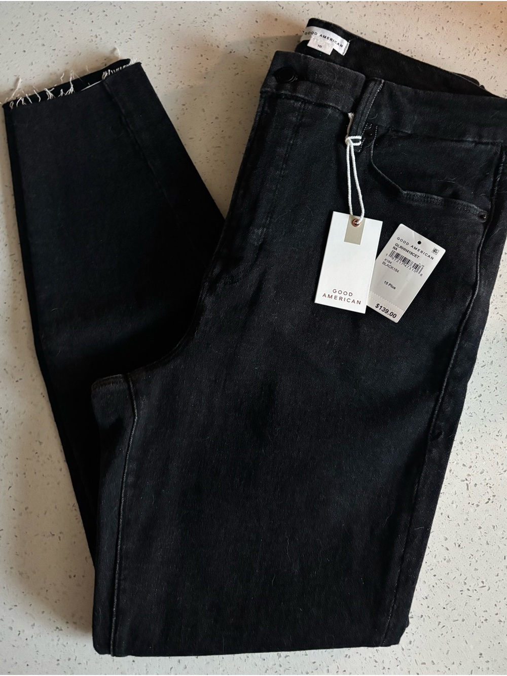 Good American Black Skinny Jeans with Raw Hem